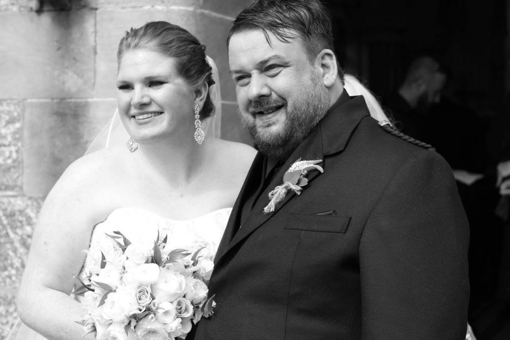 Happy couple just outside church